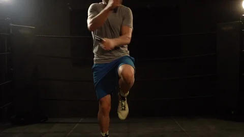 Bearded boxer making rope jumps in the ring in slow motion Stock Footage 101209246