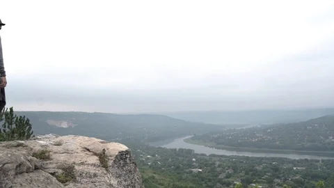 A bearded boy with a backpack and hat is glad he has arrived at his destination. Stock Footage 127184540