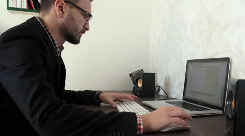 Bearded business man is working by pc in his office Stock Footage 57493834
