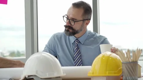 Bearded businessman or engineering manager working with team in modern office Stock Footage 139797978