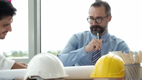 Bearded businessman or engineering manager working with team in modern office Stock-Footage 139797993