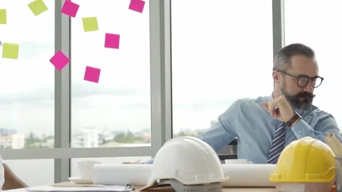 Bearded businessman or engineering manager working with team in modern office Stock Footage 139798006