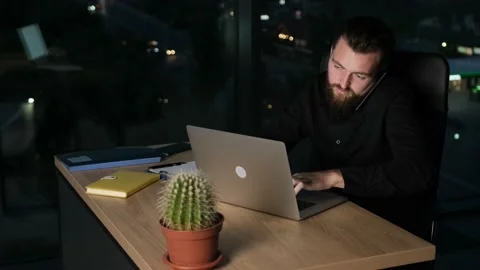 Bearded businessman talking at the phone while is working in office. Stock Footage 138462074