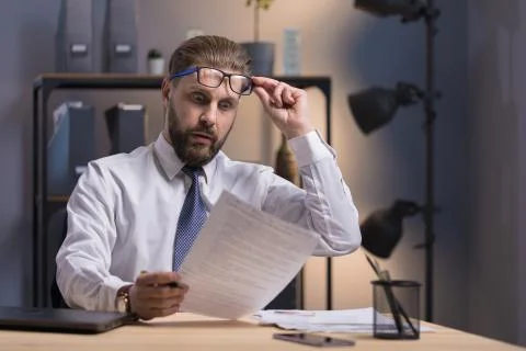 Bearded Clerk is Extremely Surprised by the Document Data Stock Photos