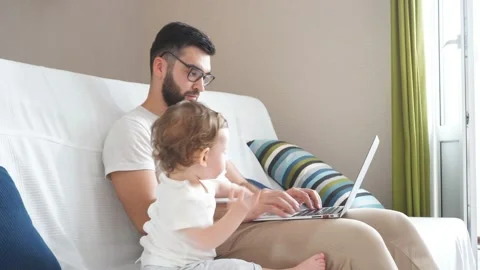 Bearded clever handsome man in glasses working on the laptop Video stock 117893751