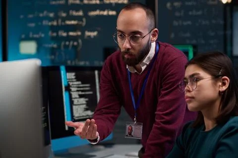 Bearded Computer Engineer Advising Trainee Stock Photos