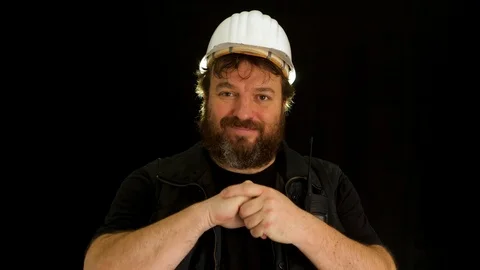 Bearded construction worker spits in his hands and measures from the screen w 스톡 동영상 121601028