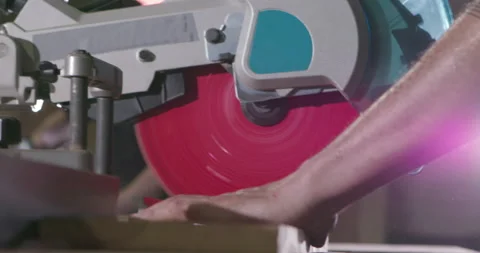 Bearded construction worker uses a table saw to cut wood on a construction site Stock Footage 186830308