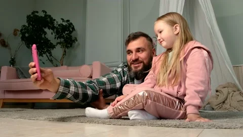 Bearded Dad is taking selfie with his cute blond daughter. Family conception Stock Footage 161836267