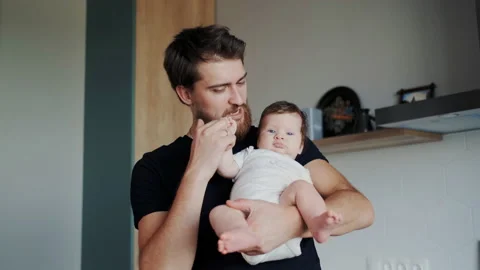Bearded Father Having Fun with Little Cute Infant on Hands. Funny Dad Playing Stock Footage 149806086
