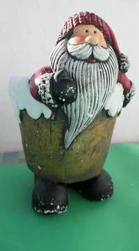 Bearded figurine in ceramic pot on green base Stock Photos