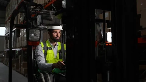 Bearded forklift driver during work in warehouse Stock Footage 161951460