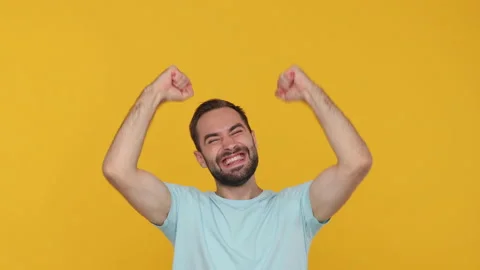 Bearded fun young man 20s in basic casual blue t-shirt looking camera shocked Video stock 148285690