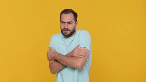 Bearded fun young man 20s in basic casual blue t-shirt isolated on yellow 스톡 동영상 148288938