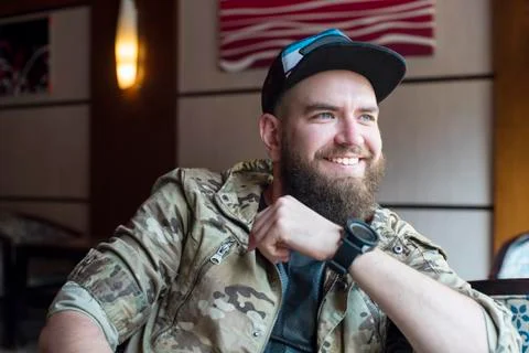 A bearded guy. A bearded smiling man. Stock Photos