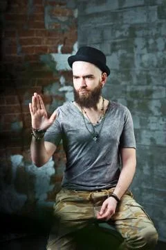 A bearded guy in a black hat. Stock Photos