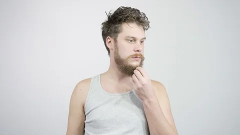 A bearded guy came up with the idea and emotionally raised a finger up 動画素材 121688253