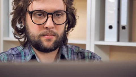 Bearded guy close a laptop posing with smile Stock Footage 115265613
