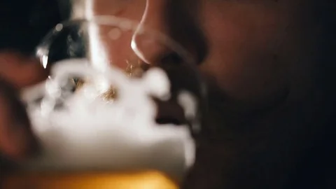 Bearded guy is drinking beer Video stock 75657214