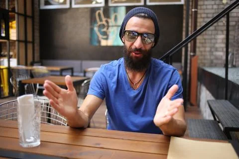 Bearded guy gesticulate with hands Stock Photos