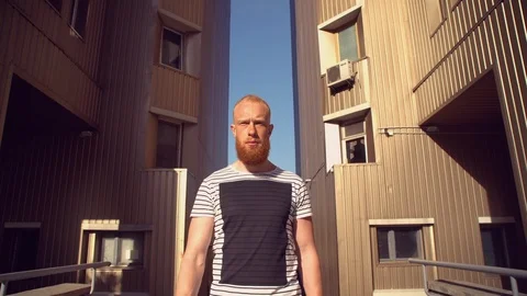 Bearded guy going near house Stock Footage 112066352