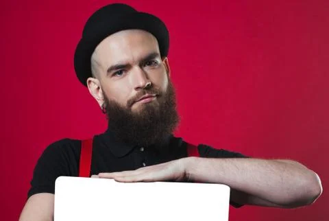 Bearded guy holding empty paper Stock Photos