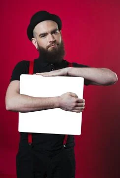 Bearded guy holding empty paper Stock Photos