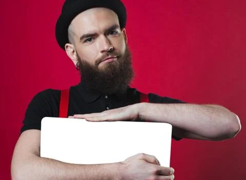 Bearded guy holding empty paper Foto stock