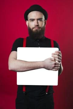 Bearded guy holding empty paper Stock Photos