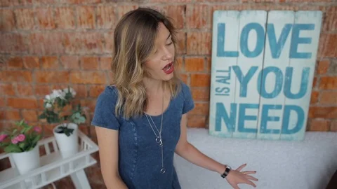 The bearded guy plays the guitar. The guy and the girl are singing Stock Footage 88061905