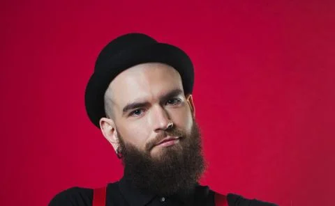 Bearded guy on a red background Stock Photos
