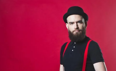 Bearded guy on a red background Stock Photos