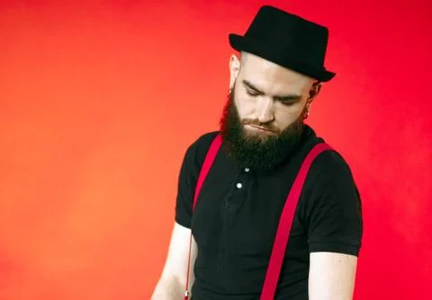 Bearded guy on a red background Stock Photos