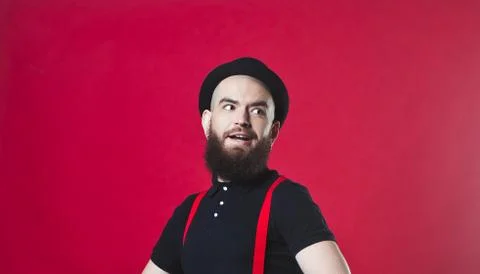 Bearded guy on a red background Stock Photos