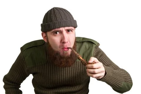 Bearded guy smoking a pipe Stock Photos