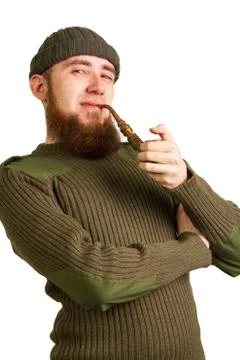Bearded guy smoking a pipe Stock Photos