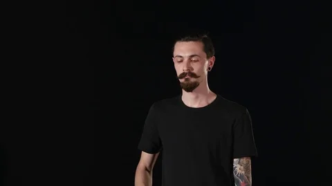 Bearded guy talking on the phone Stock Footage 77569126