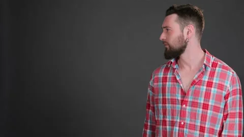 Bearded guy turns his head to the copy place Stock Footage 251463532