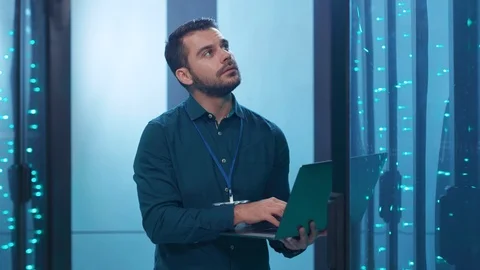 Bearded handsome IT engineer with laptop providing hardware system upgrade on Video stock 119841962