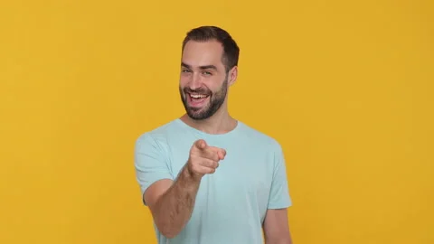 Bearded handsome young man 20s in basic casual blue t-shirt looking at camera Stock Footage 148286447