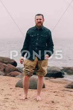 Bearded hipster on the beach Stock Photos