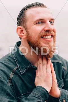 Bearded hipster on the beach Stock Photos