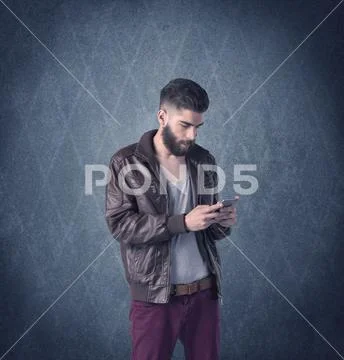 Bearded hipster standing in elegant clothes Stock Photos