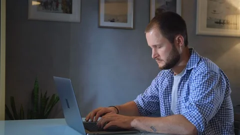 Bearded hipster working into process of startup project creating in coworking Stock Footage 128584570