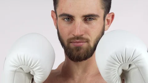 Bearded male boxer smiling to the camera, standing in fighting stance Stock Footage 101828640