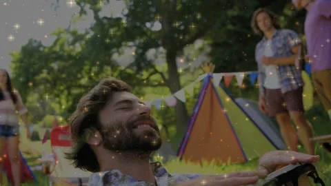 Bearded man after leaning back, tapping bongo and entertaining peers, causing Stock-Footage 333494547