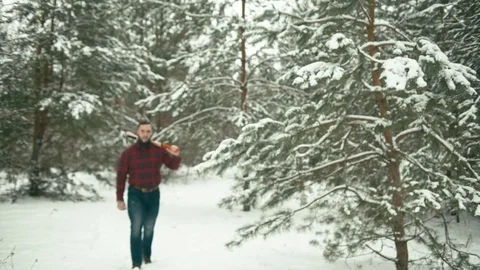 Bearded man with axe in snowy forest. Stock Footage 85142150