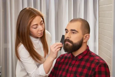 Bearded man, barber with comb. Stockfoto's