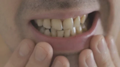 Bearded man brushing his teeth in the mirror. Stock Footage 86526342