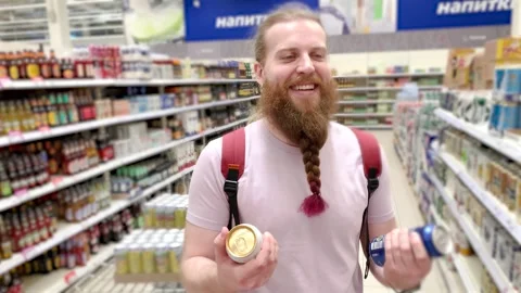 Bearded man chooses beer 스톡 동영상 277185743